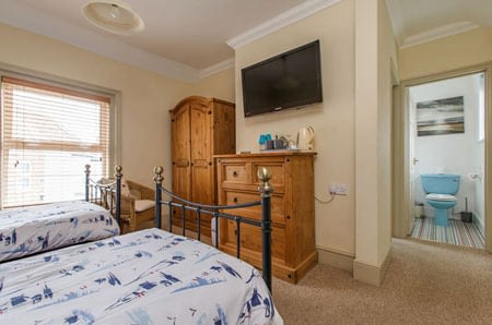 The twin room showing the door through to the ensuite bathroom & wc